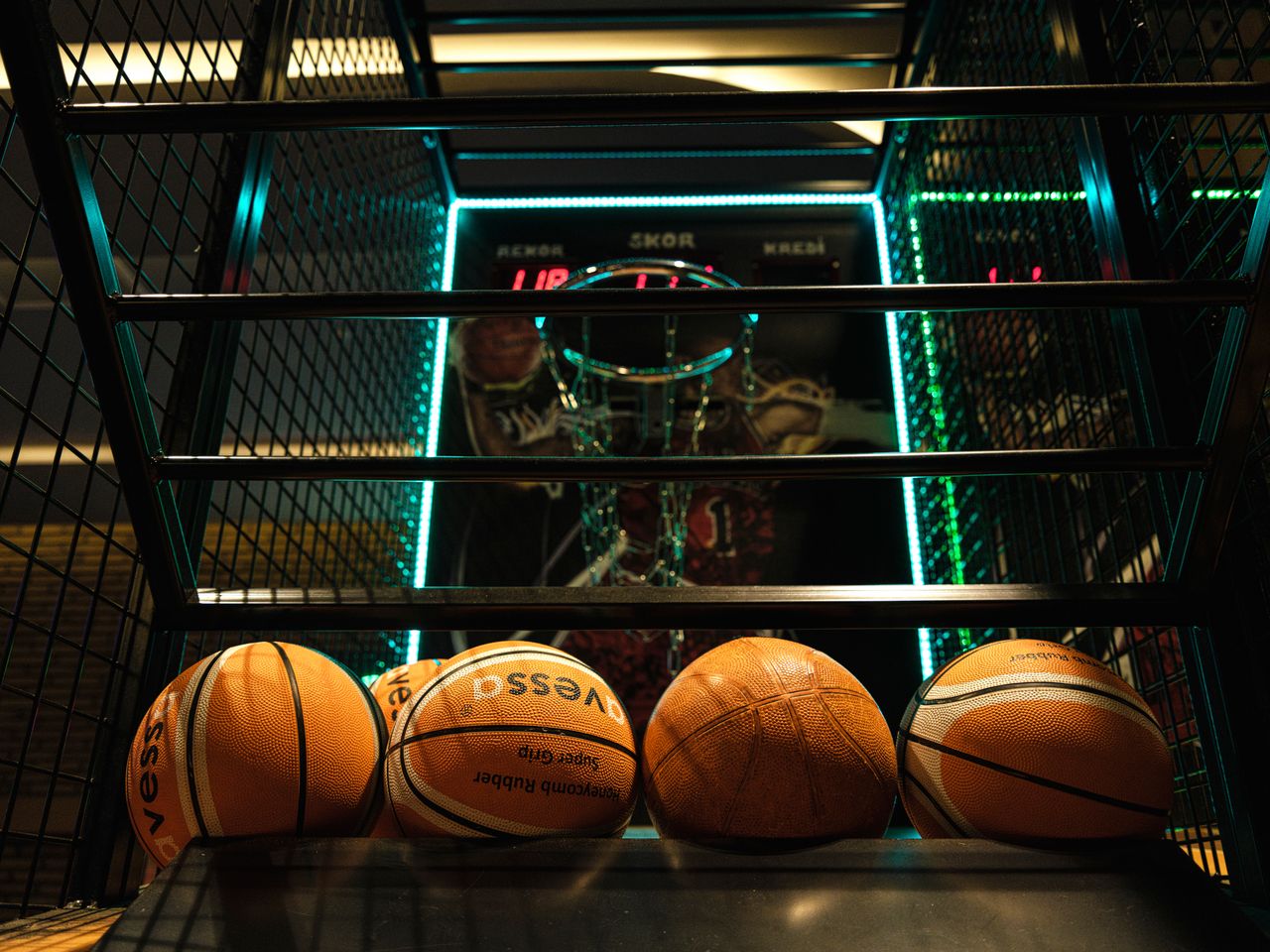 delivery-policy Close-up view of basketballs lined up for an arcade basketball hoop game.